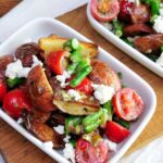 Salad in a white rectangular dish.