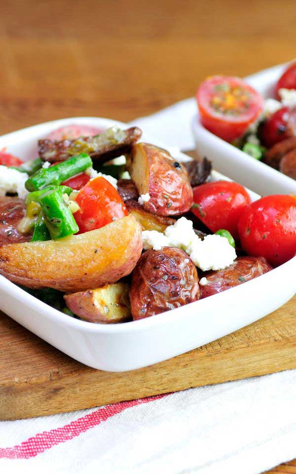 A white rectangular dish with a mixed salad.