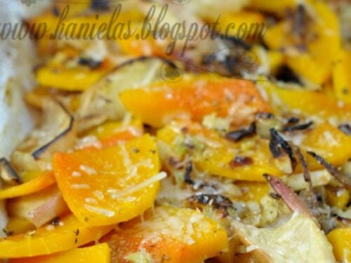 Baked sliced squash with marinade, apples, cheese and nuts.