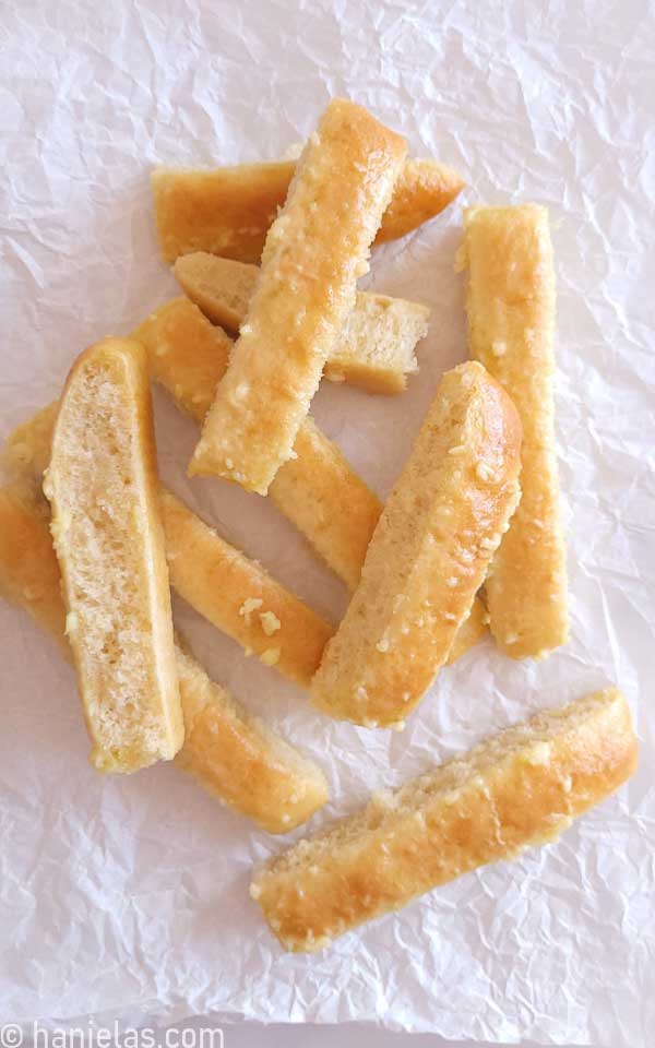 Small pieces of bread with bits of garlic on the top.