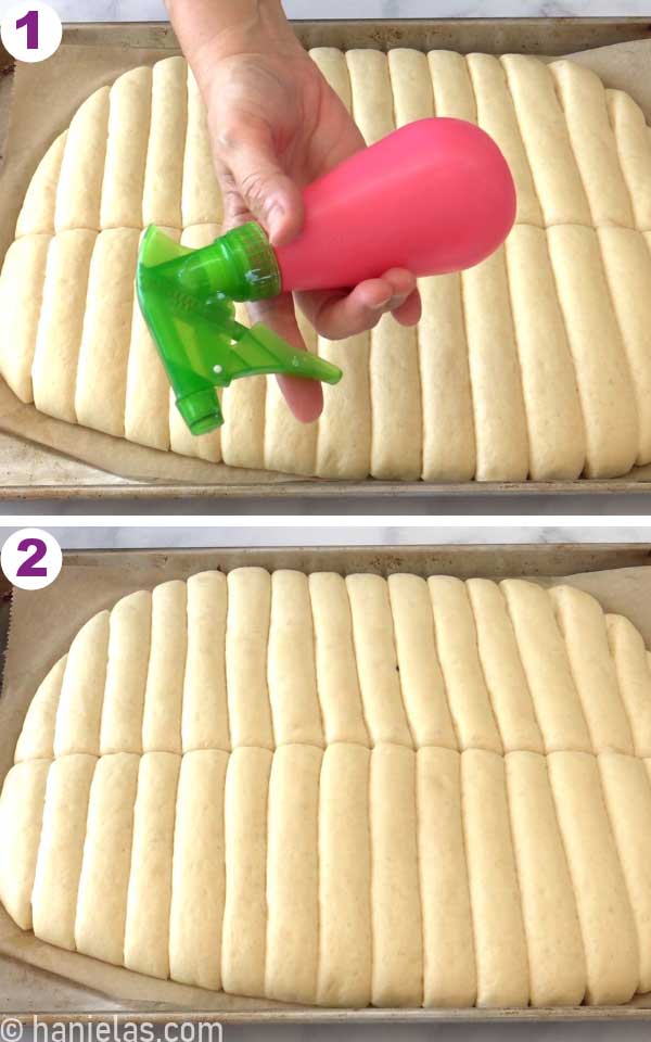 Hand holding a spray bottle over risen and shaped yeast, dough misting the dough with water before baking.