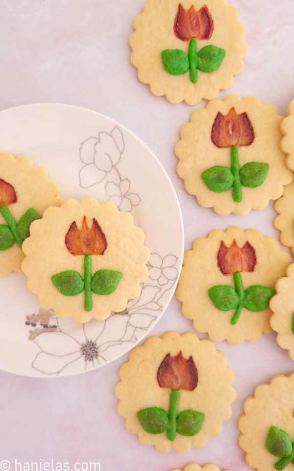 Round cookies with a scalloped edge with a baked-in strawberry.