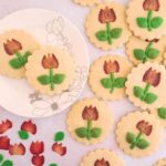 Round cookies with a baked-in tulip-shaped strawberry.