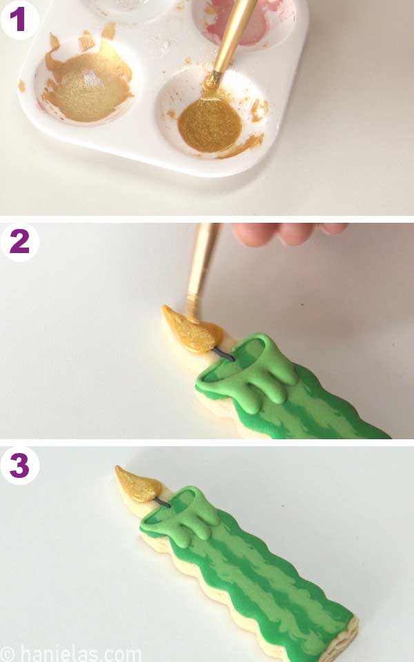 Painting icing with gold edible paint.