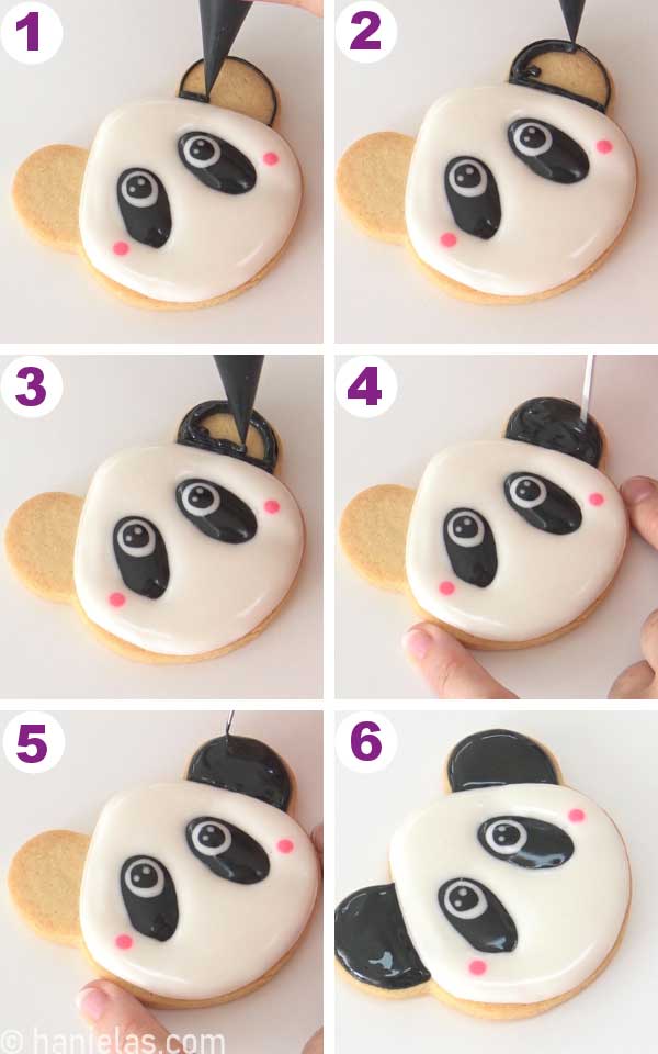 Hand holding a piping bag and flooding the ear of the animal head cookie.