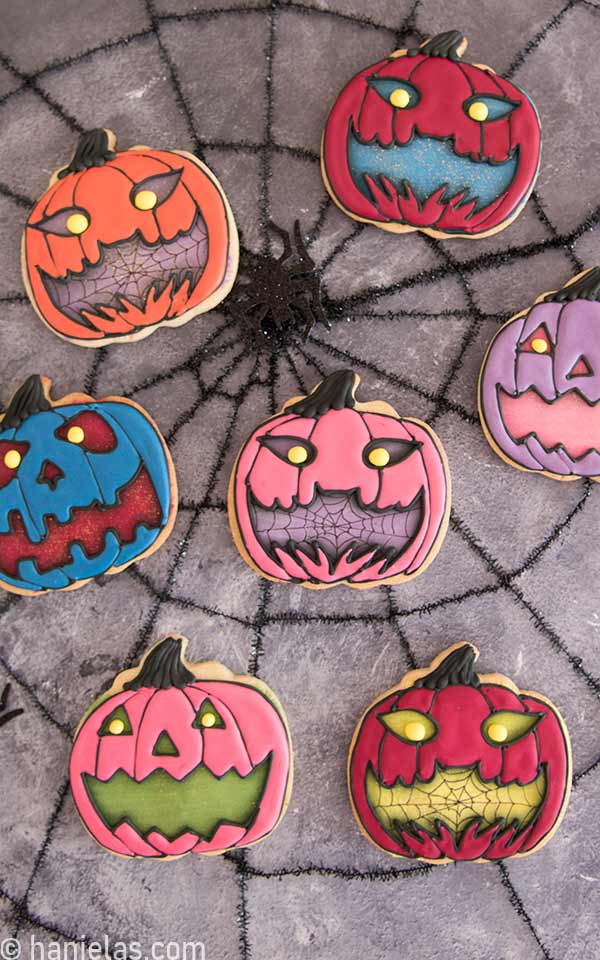 Decorated cookies displayed a spiderweb background.
