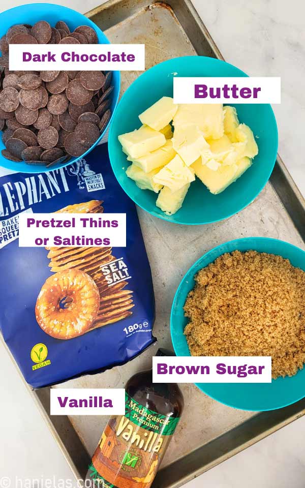 A baking sheet with bowls filled with ingredients.