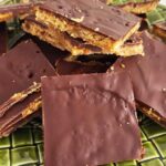 Close-up of sliced pretzel toffee on a plate.