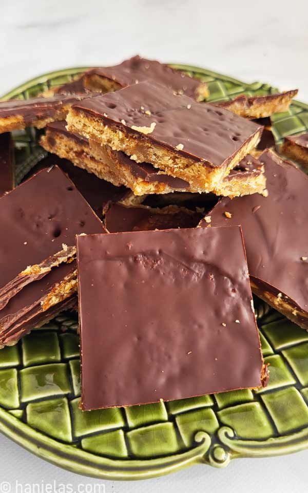 Close-up of sliced pretzel toffee on a plate.