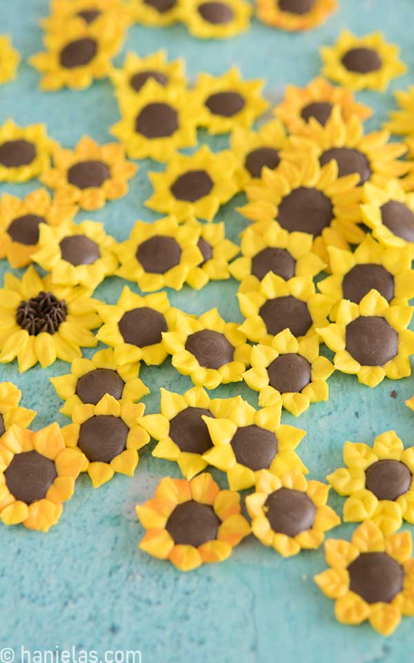 Yellow-orange royal icing sunflowers.