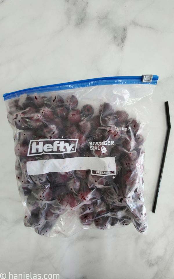 Ziploc bag with frozen cherries.