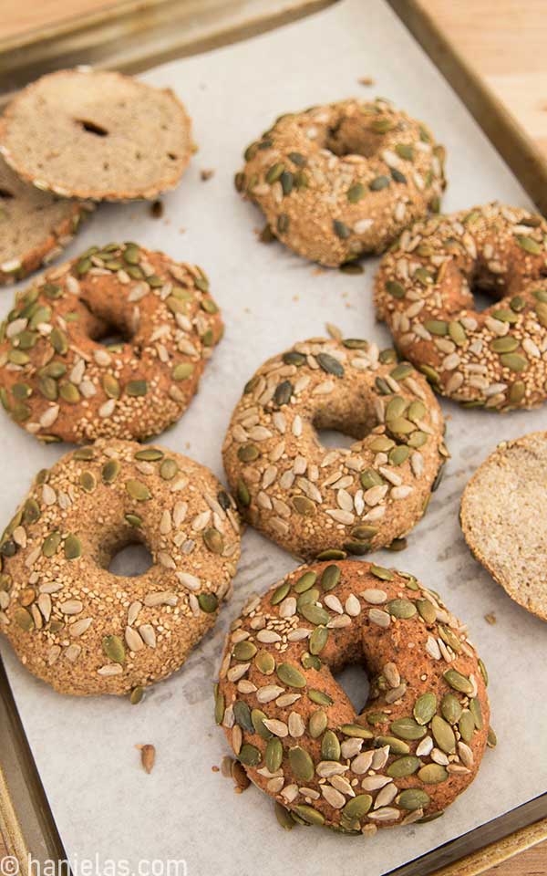 Baked bagels on a baking sheet lined with parchment.