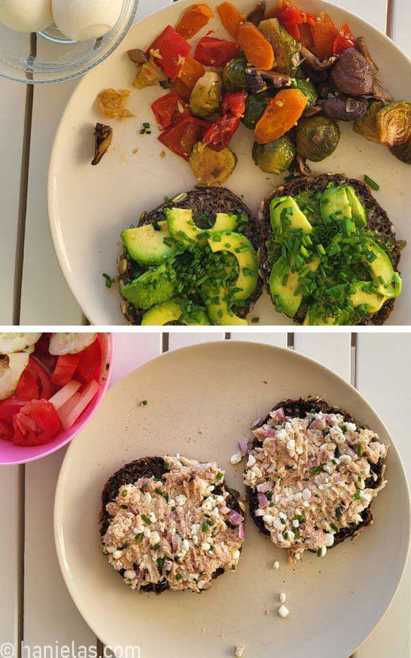 Plates with sliced bagels topped with tuna spread, avocado and chives with roasted vegetable on the side.