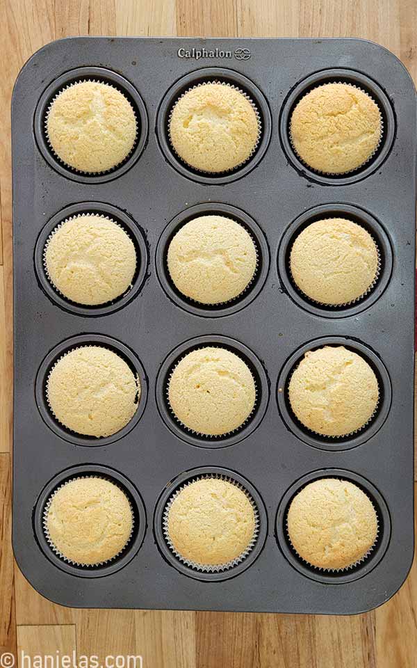 Baked cupcakes in a muffin pan.