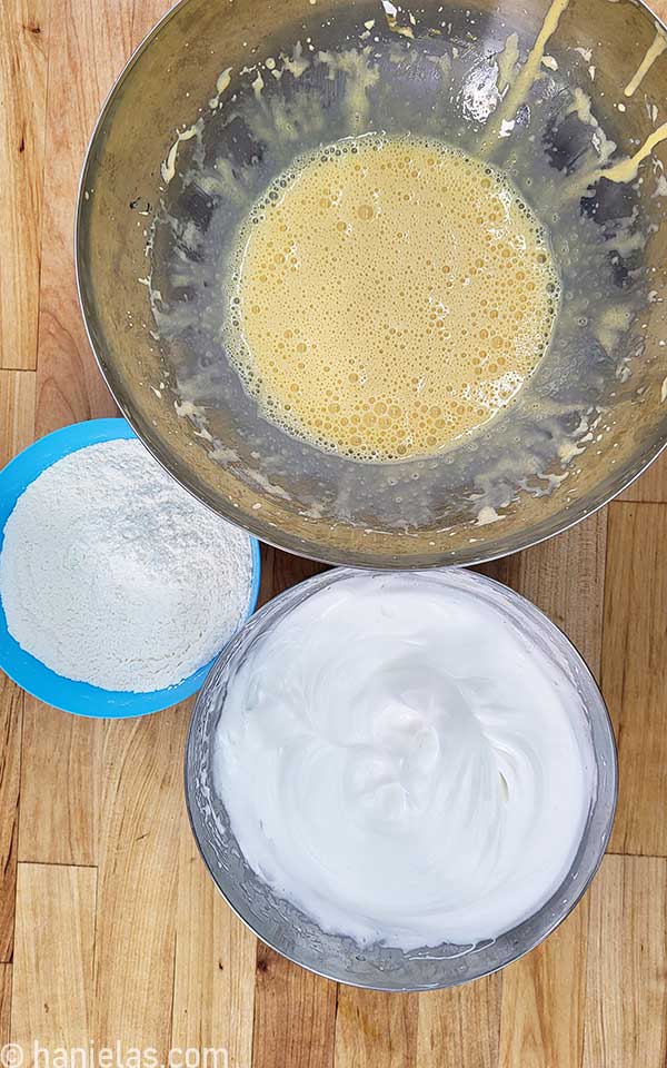 Three bowls on a butcher's block.