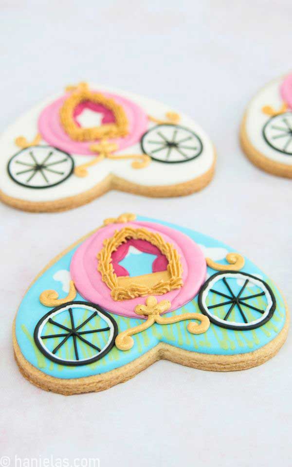 A close-up of heart cookie decorated with icing.