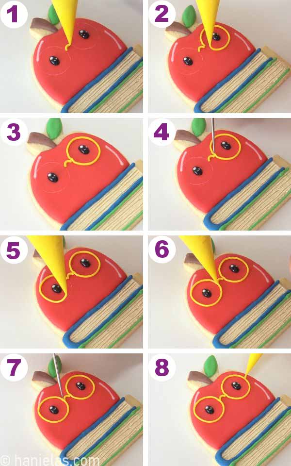 Piping yellow glasses onto the cookie.