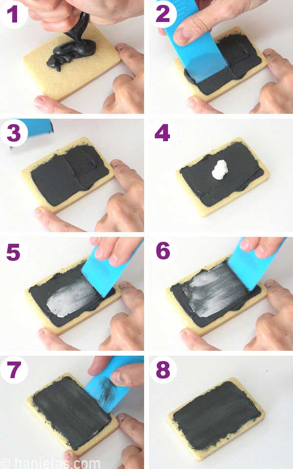 Spreading black and white icing over the cookie.