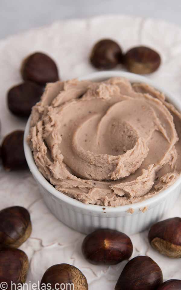 Lightly brown with a hint of purple puree in a white ramekin dish.