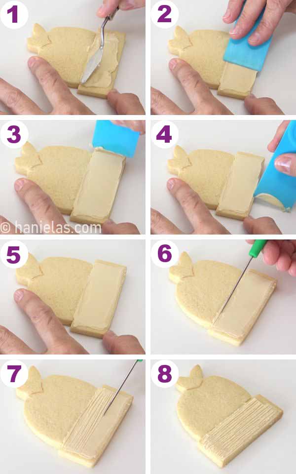 Spreading icing over the cookie.