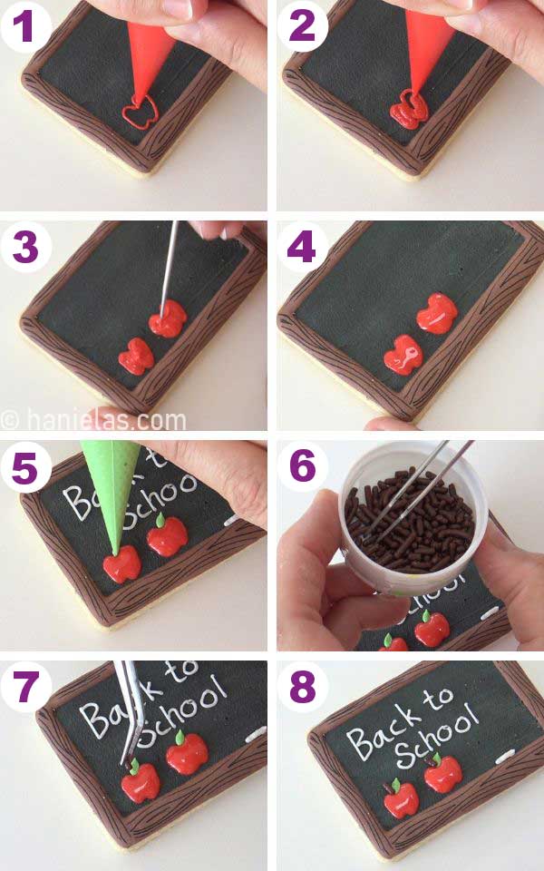 Piping red apples onto the black icing.