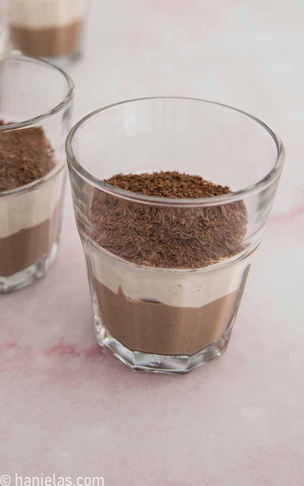 A close up of vanilla and chocolate layers in the glass.