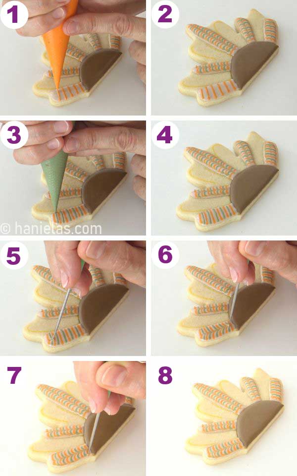 Piping feathers using marbling royal icing technique onto a cookie.