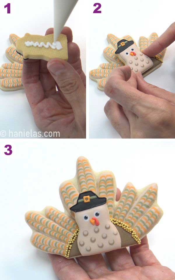 Hand holding a decorated cookie.